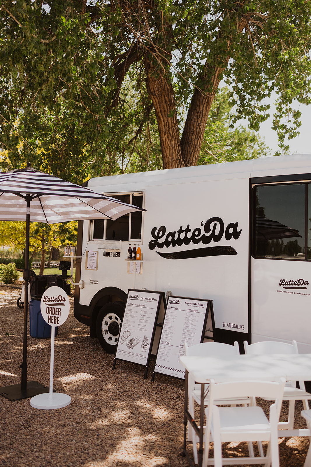 Latte'Da mobile espresso van set up under cottonwood trees at Salt & Acres in Fort Lupton, Colorado