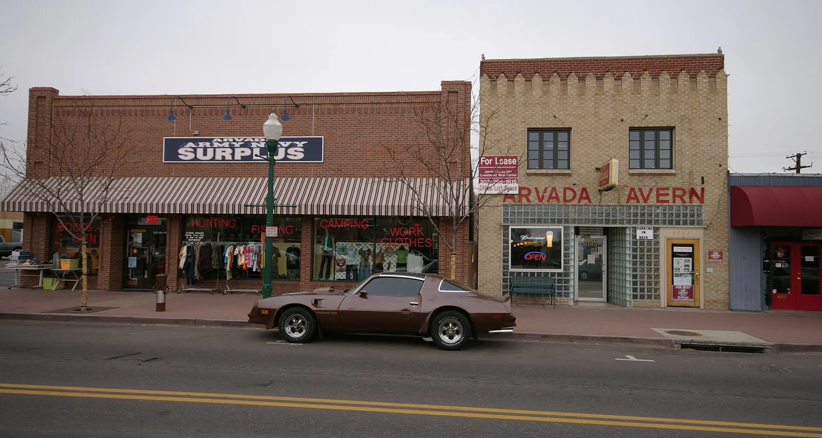Historic brick storefronts along a street in Olde Town Arvada, Colorado