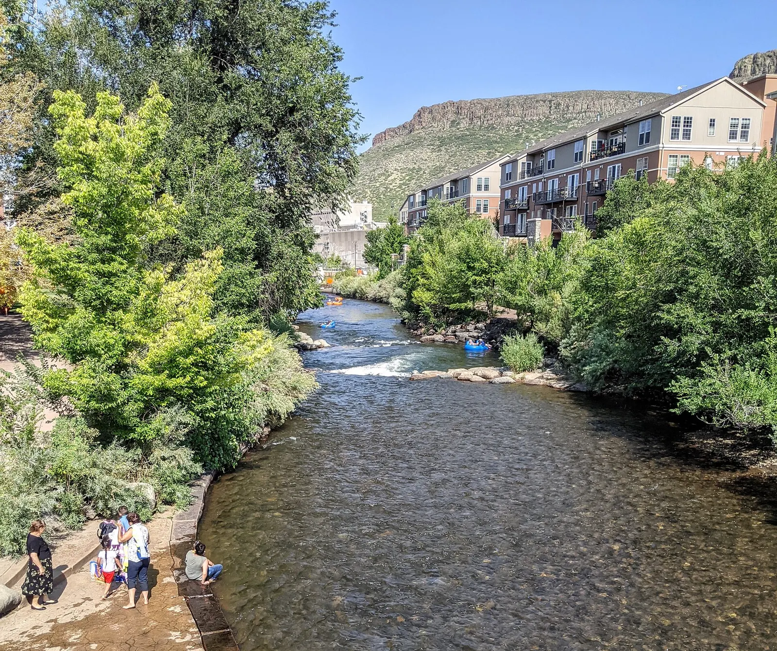 Clear Creek flowing through Golden, Colorado, with South Table Mountain and the foothills behind
